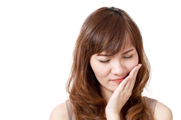 woman feeling pain from canker sores
