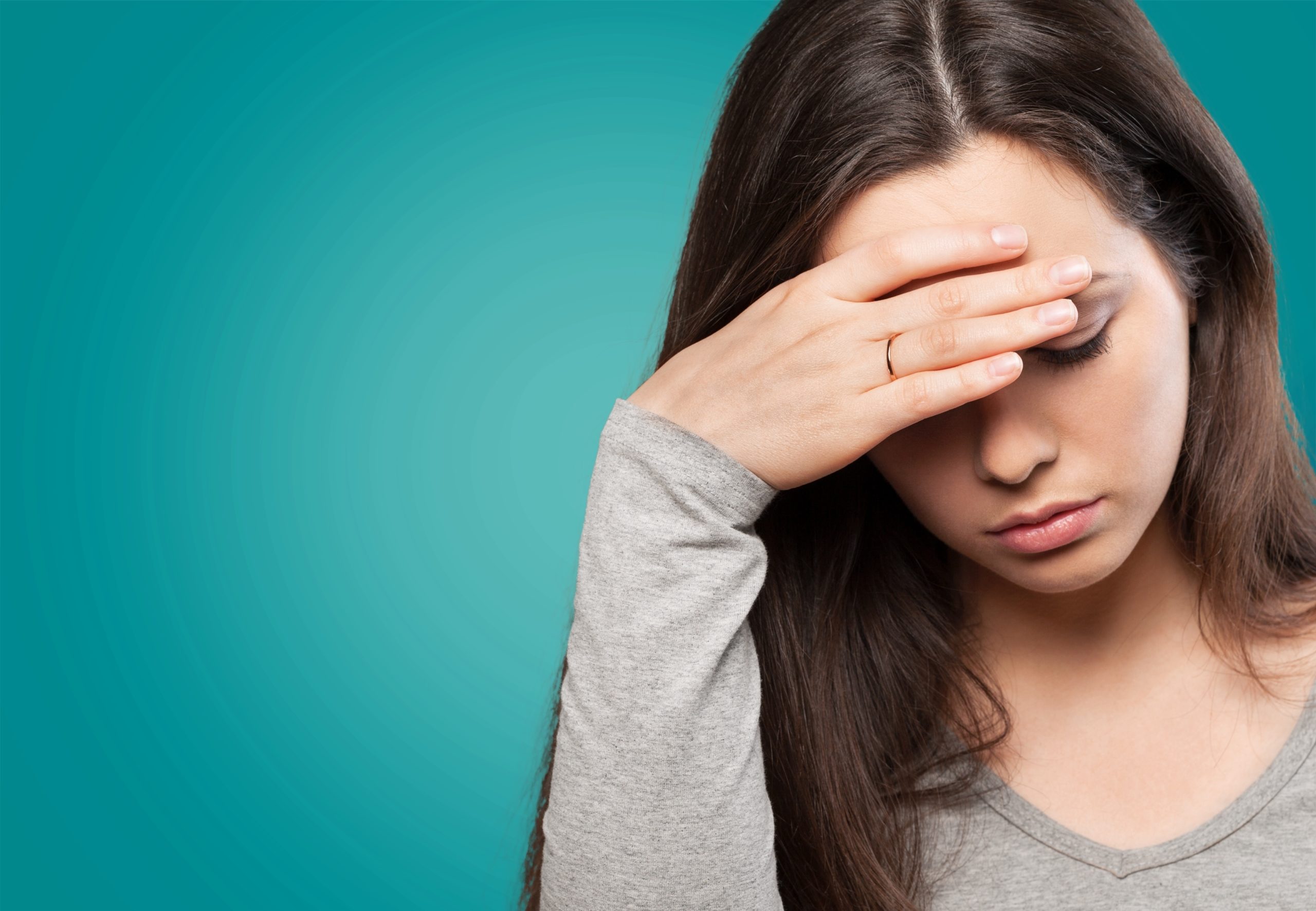Anemic woman with her head down treatment